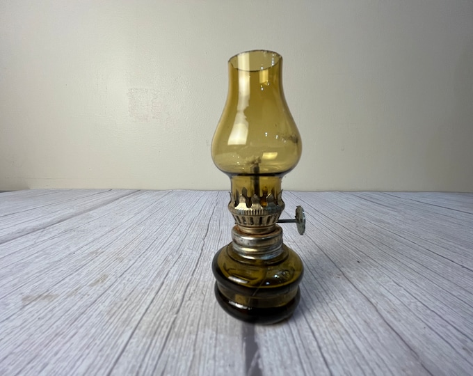 Small gold double rim round glass oil lamp with scalloped chimney and wick