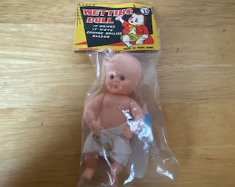 Vintage Dime Store Wetting  feeding Doll New in Package plastic mini small with bottle and diaper made in Hong Kong