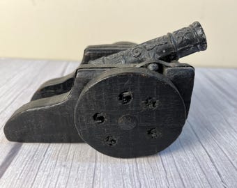 Wood and embossed cast cannon