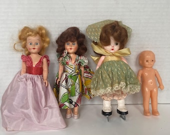 Set of 4 vintage small Plastic/ celluloid play dolls including S&E Doll, Plastic Holded Arts Co, Irwin and Another Sleepy Eye Doll