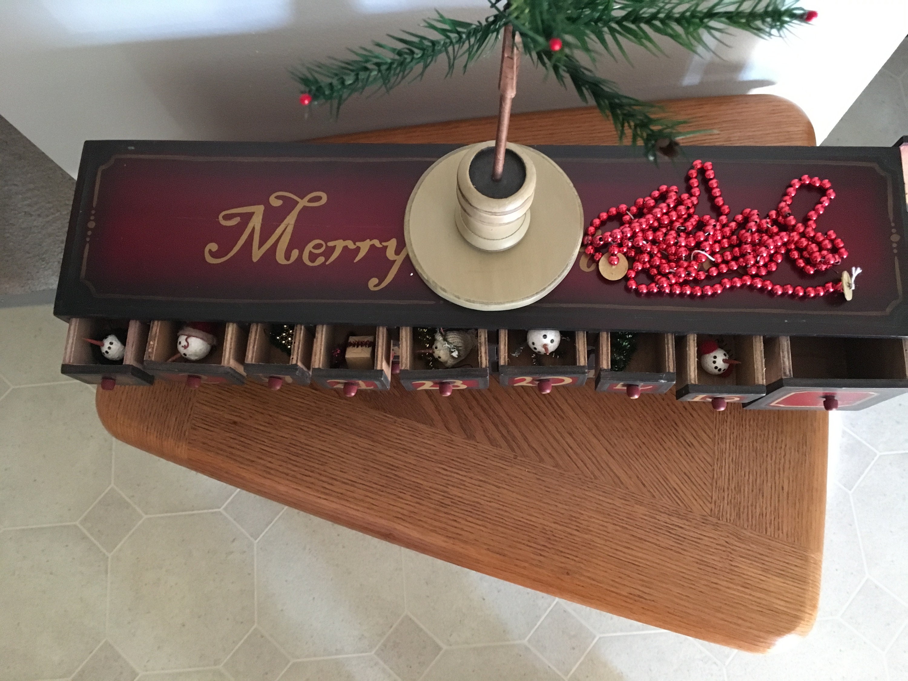 Vintage wooden Advent calendar box with christmas tree and ornaments Vintage wooden Advent calendar box with christmas tree and ornaments