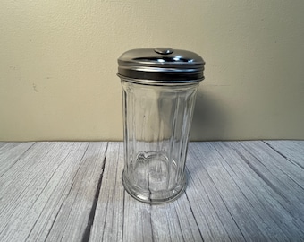 Ribbed glass sugar dispenser with metal lid