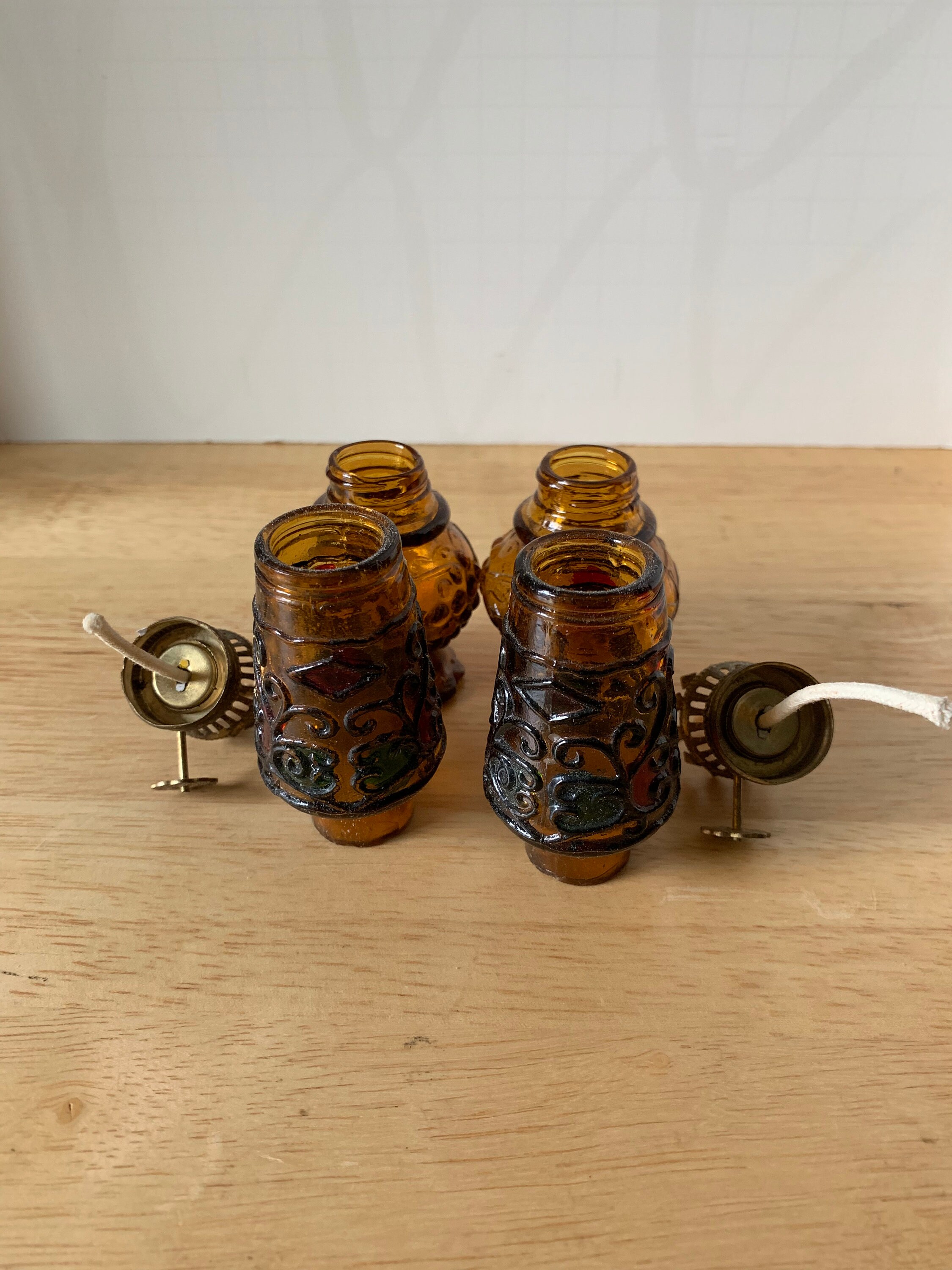 Vintage pair of brown glass oil lamps multi colored chimmneys with