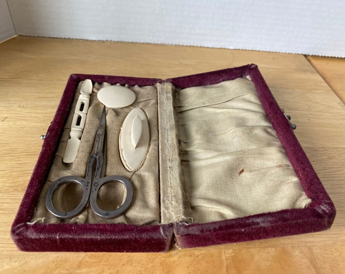 Vintage manicure set with burgundy red velvet case with lock