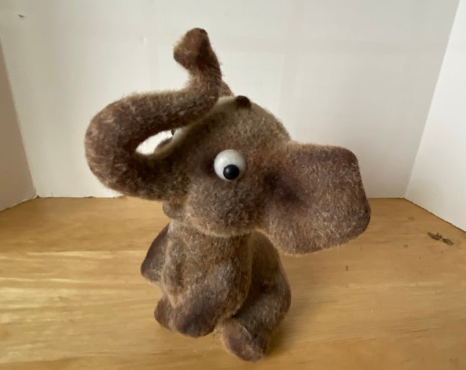 Delightful Flocked brown elephant bank with bottom cap and made in Hong Kong