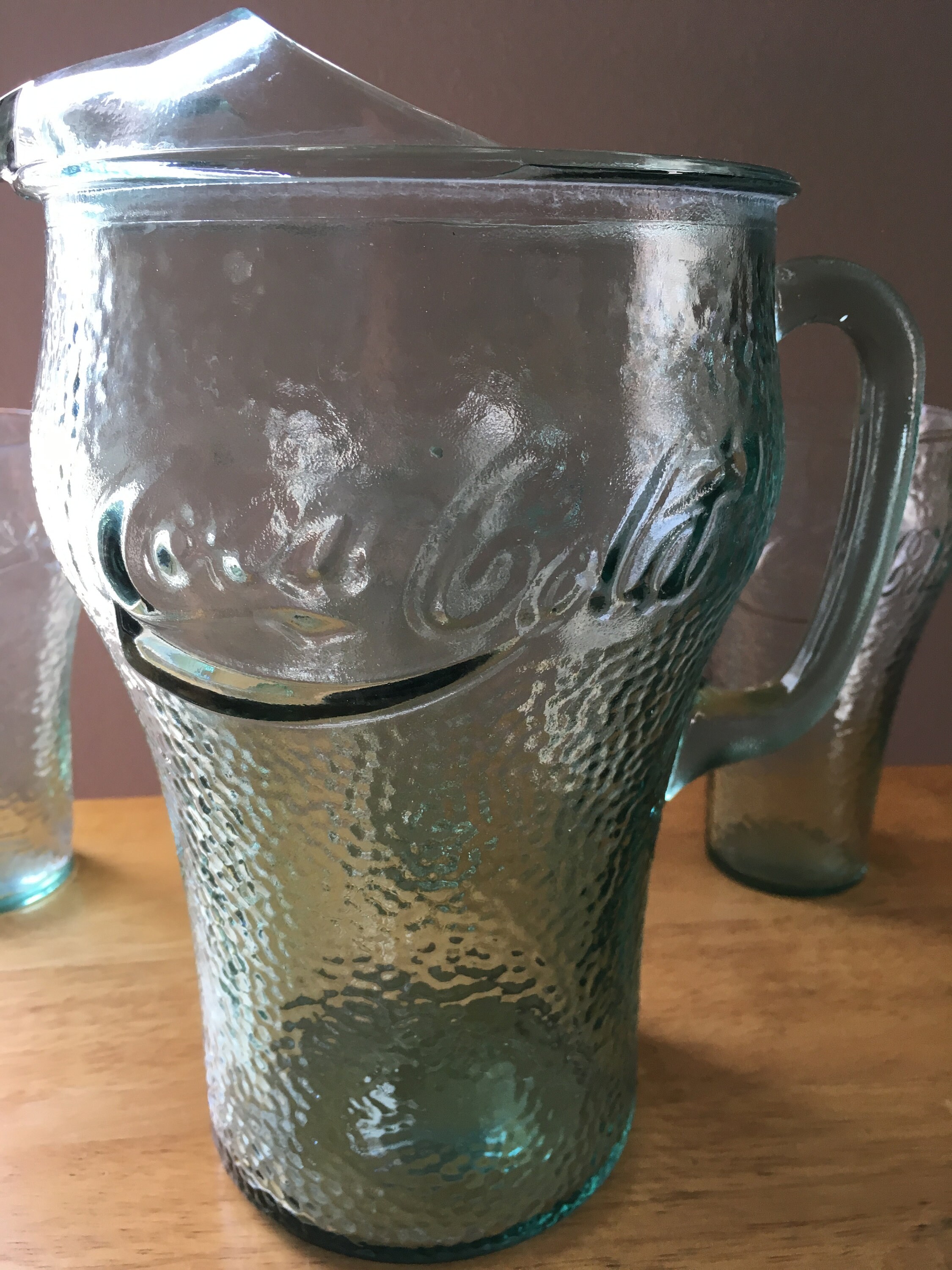 Green bubble glass Coke pitcher and 8 green bubble glass coke glasses