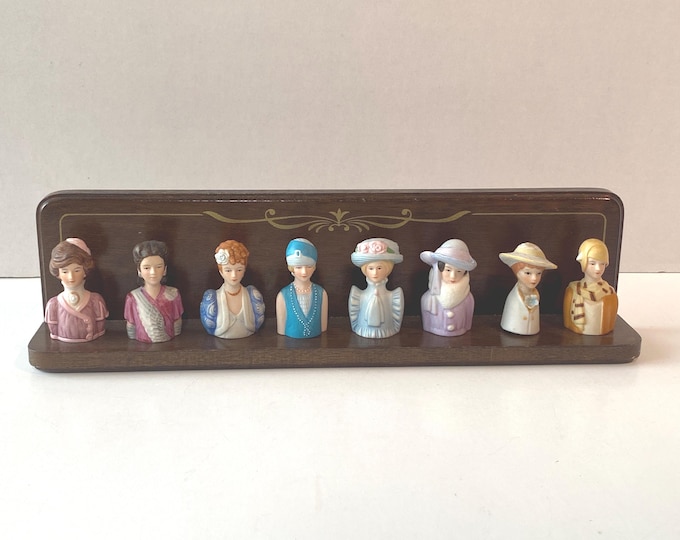Avon Thimble vintage Porcelain set of 8 Heads Busts of women through the century with wooden Holder Rack from 1982-1984