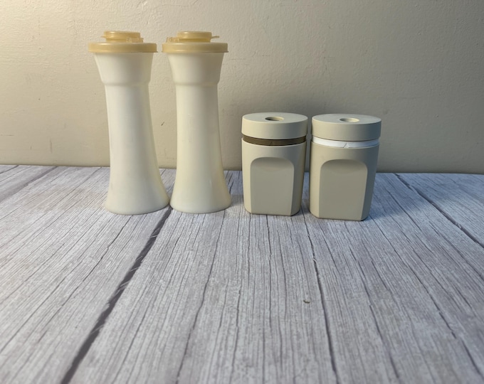 Set of Tupperware salt and pepper shakers with lids