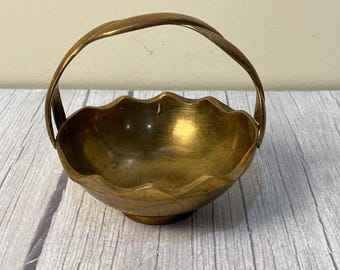 Small brass trinket bowl with scalloped edges twisted handle made in India