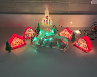 Vintage Electrified Tiny Town 18 Piece Completed Set Plastic Christmas Village with buildings, ice pond, trees, skaters and light set w/Box