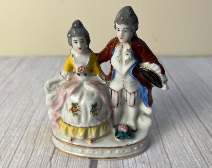 Courting man and woman made in Occupied Japan figurine