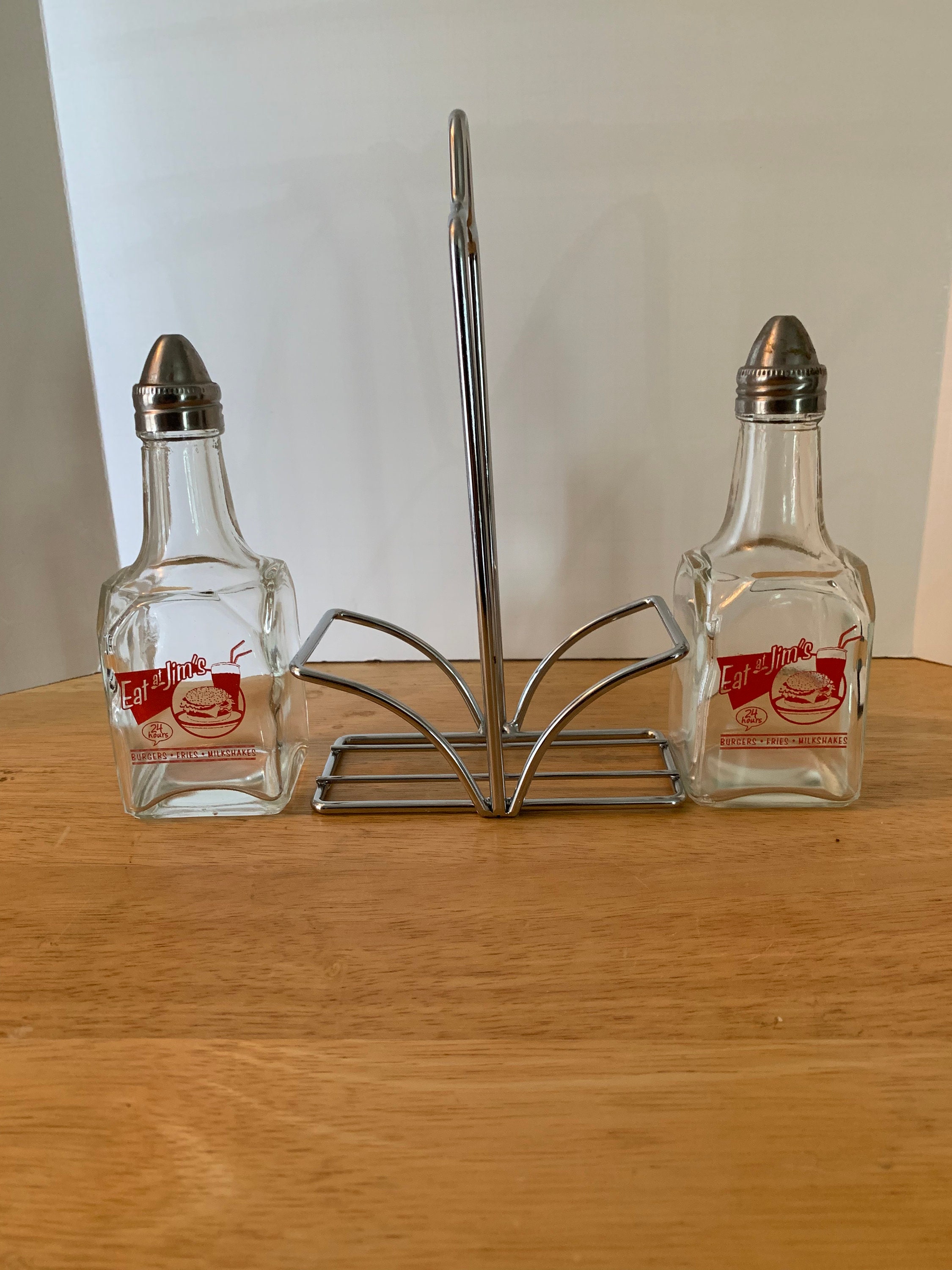 Eat at Jim's vinegar and oil dispenser with holder