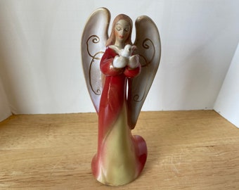 Beautiful Ceramic porcelain Angel holding dove