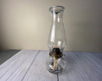 Clear round plain glass finger oil lamp with beaded chimney and wick