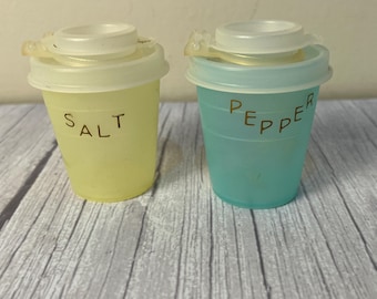 Set of Tupperware salt and pepper shakers with lids