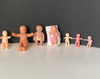 Vintage set of 8 miniature rubber, celluloid and plastic babies