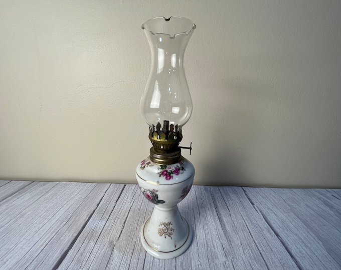 Vintage small white milk glass floral pedestal oil lamp with scalloped chimney and wick