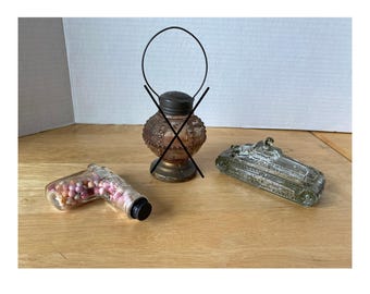 Set of 2 Early 1900s Candy Dispensers of army tank, pistol  (lantern is sold)