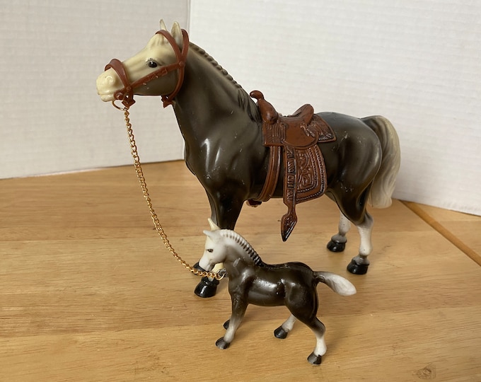Vintage Hard Plastic Mare with Foal on Chain includes saddle and bridle made by SW