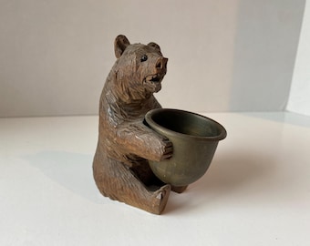 Vintage Black Forest Wooden Carved Bear holding bronze pot with Glass Bead Eyes