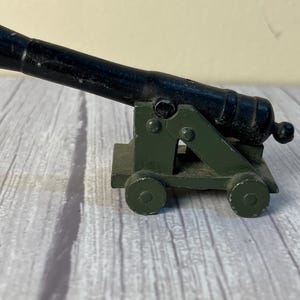 casted cannon paper weight