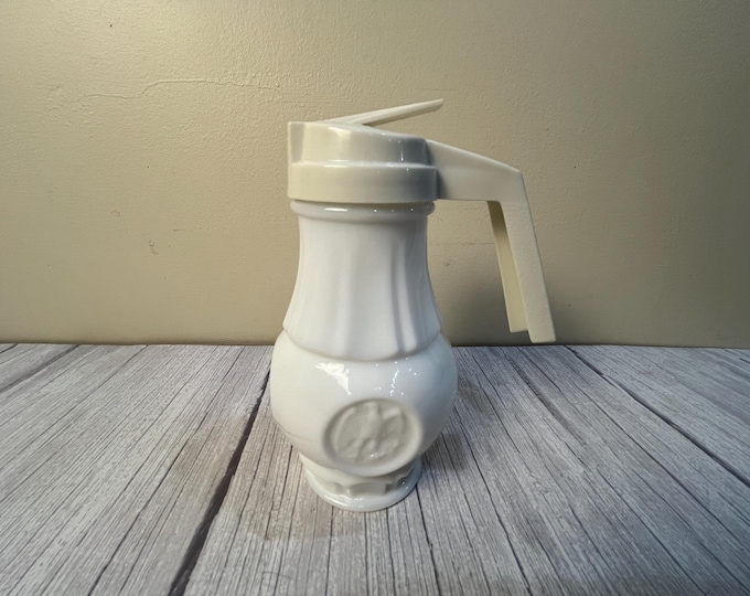 Vintage eagle embossed milk glass base plastic top syrup dispenser