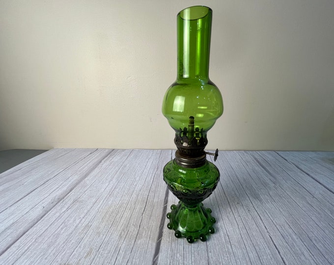 vintage small bullseye green glass oil lamp with beaded base bubble chimney and wick