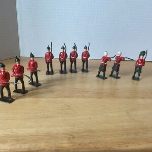 Britains  Ltd. Set of 10 Soldiers - 3 in Kilts and 7 standing soldiers