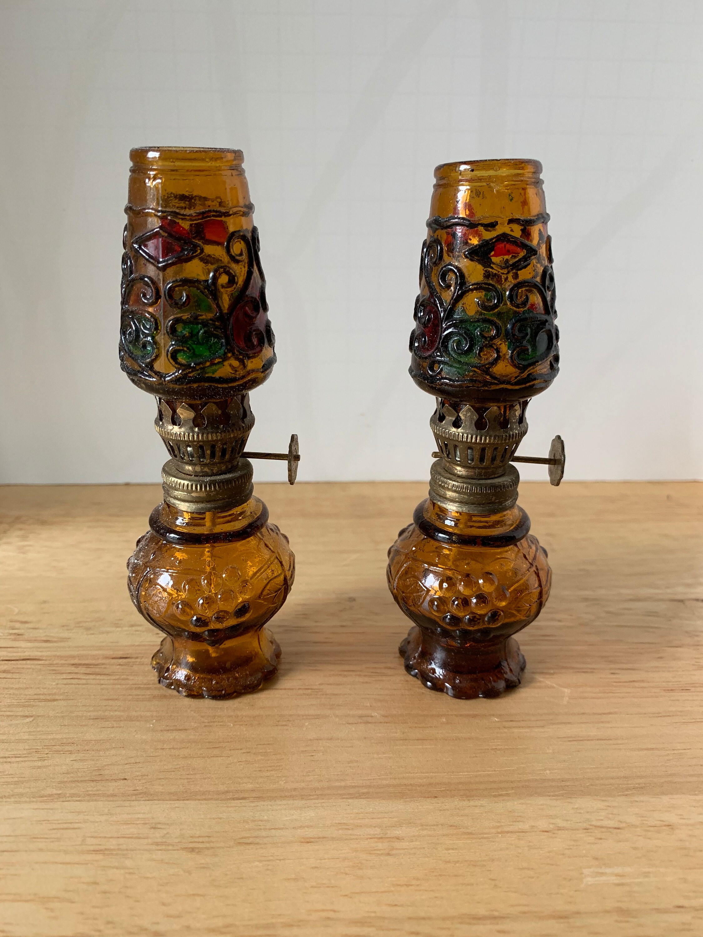 Vintage pair of brown glass oil lamps multi colored chimmneys with