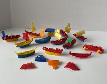 35+ piece set of Novelty  Vintage 3"  plastic ships with sails with mix and match hull, deck and sail designs and includes plastic toy car