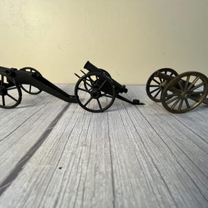2 metal 1 brass sprocket wheel cannons