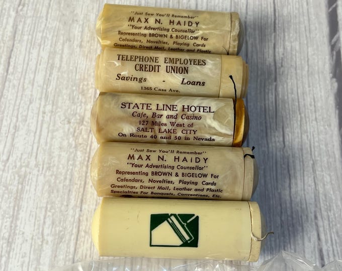 Vintage advertising Celluloid pocket sewing kit and pill holder
