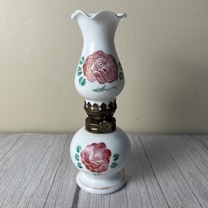 Vintage porcelain rose oil lamp with scalloped white chimney and wick