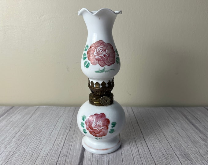 Vintage porcelain rose oil lamp with scalloped white chimney and wick
