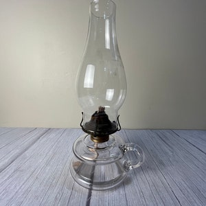 Vintage medium size double rim clear glass finger oil lamp with chimney and wick