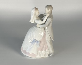 Vintage  porcelain figurine of Dancing Couple with slight hints of blue and pink on wedding dress