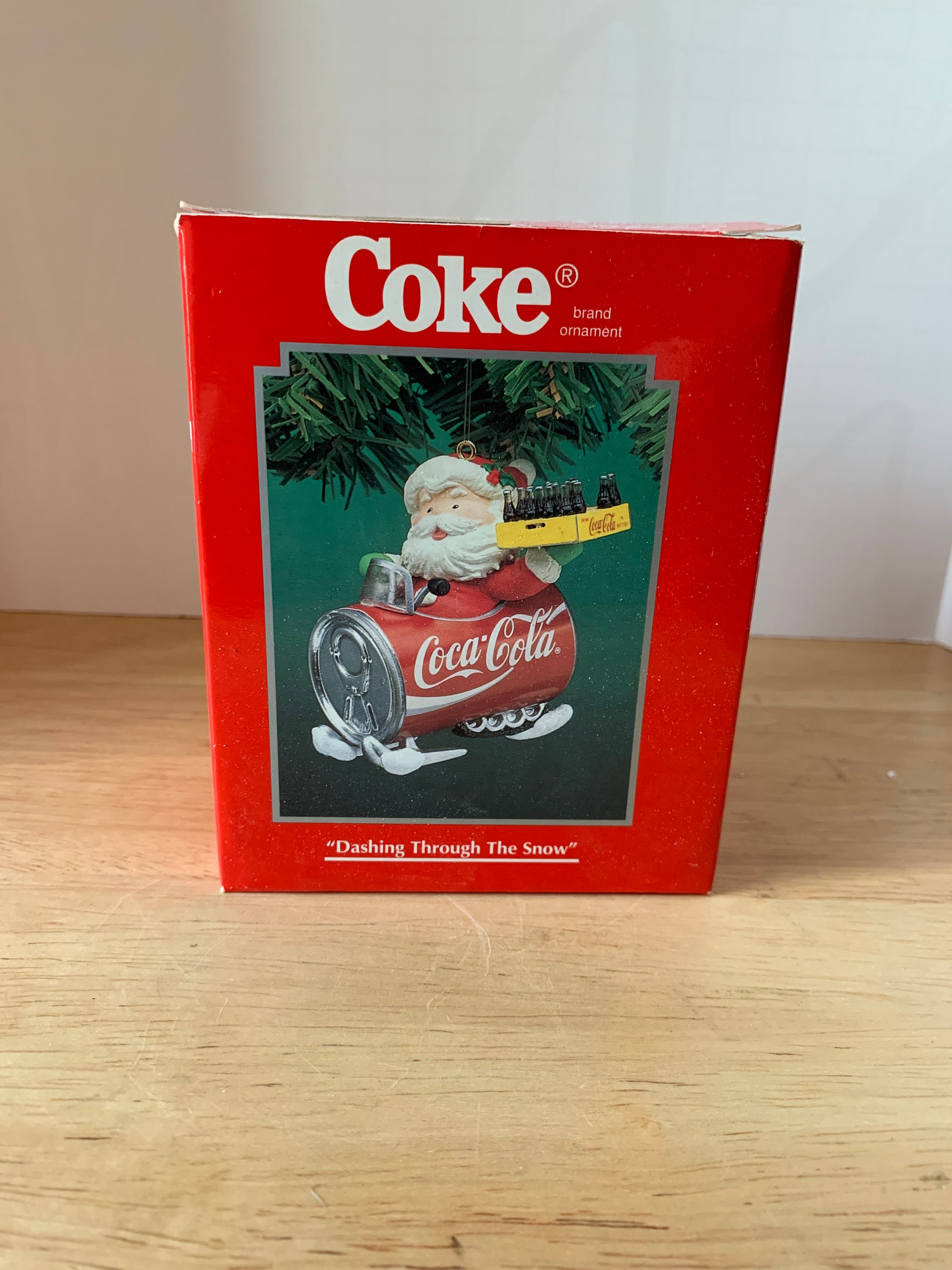 Coke Santa flying a can of Coke Christmas tree ornament