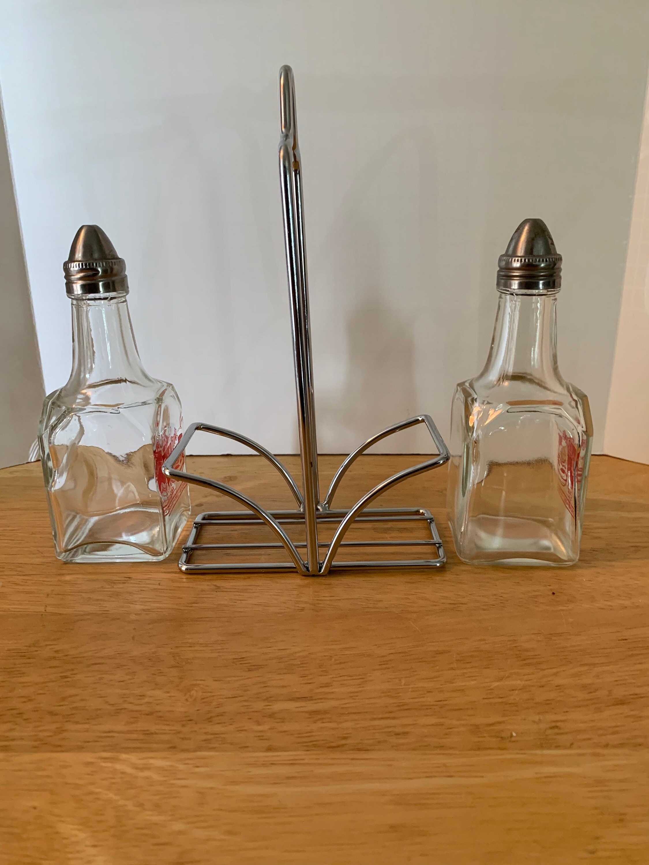 Eat at Jim's vinegar and oil dispenser with holder