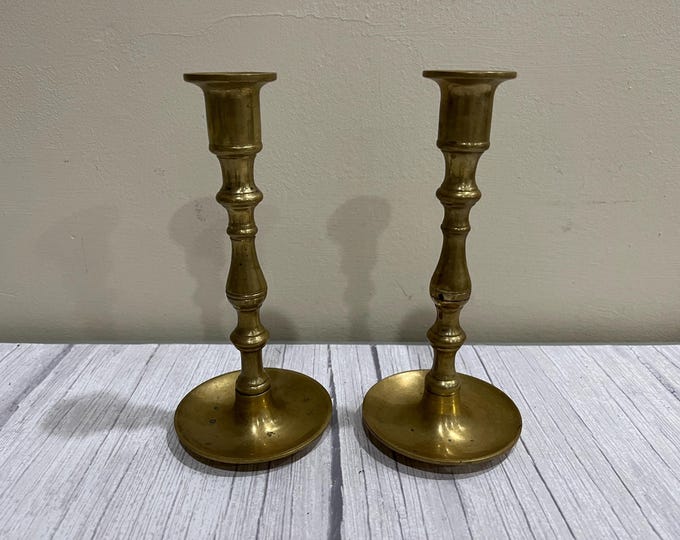 Pair of polished brass taper candlestick holders