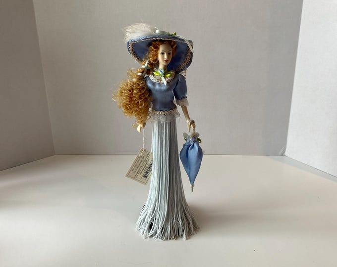 Victorian 11" tall tassel doll in baby blue long gown, ornate parasol with original tag