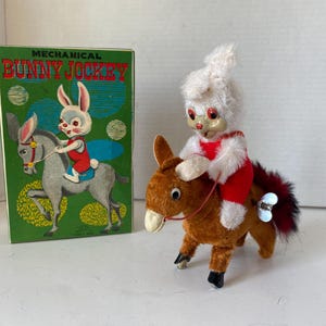 1940s Mechanical Wind Up bunny Jockey in original box in working condition