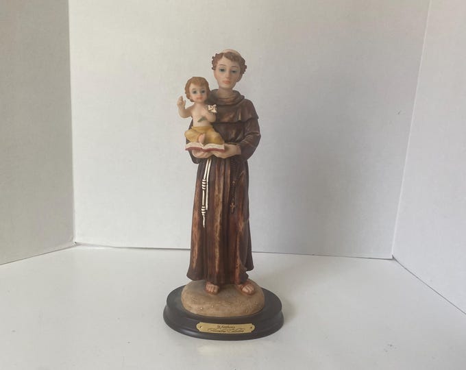 Vintage from the Florentine Collection St. Anthony and Jesus statue 11 1/2" tall on wood looking base w/Brass Plate  that says St. Anthon