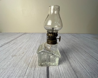 Vintage miniature clear glass house oil lamp with dark chimney and wick