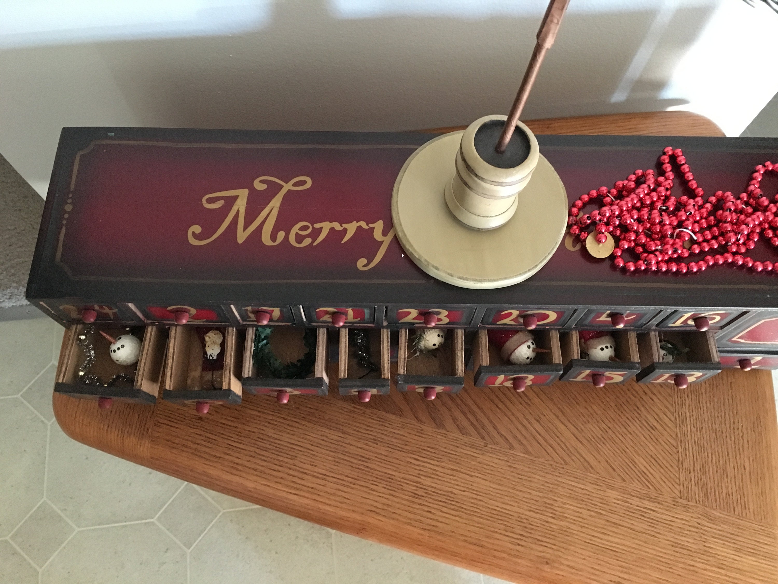Vintage wooden Advent calendar box with christmas tree and ornaments Vintage wooden Advent calendar box with christmas tree and ornaments