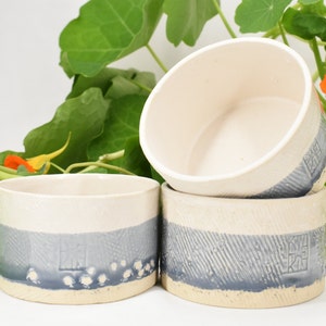 Ceramic Stoneware Bowl - white and gray-blue accent on textured surface