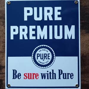 May include: A set of three ceramic mugs with a speckled, cream-colored glaze. Each mug features a different hand-painted floral design in shades of blue, green, and yellow. The mugs have a simple, rounded shape and a comfortable handle.