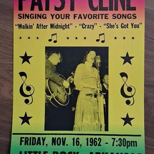 May include: Vintage concert poster for Patsy Cline, featuring a photo of her singing. The poster has a yellow, pink, and green color scheme and includes the date, time, and location of the show in Little Rock, Arkansas.