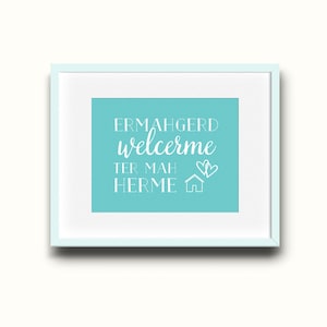 May include: A framed print with a light blue background and white text that reads "Ermahgerd welcerme ter mah herme" with a house and two hearts.