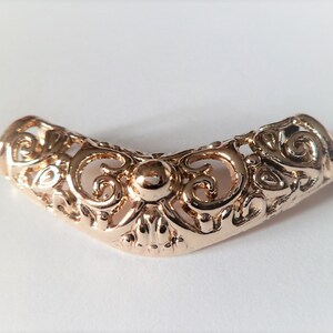 Large gold curved tubes