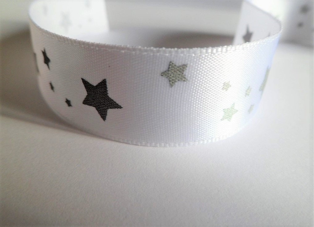 White satin ribbon with silver stars motif